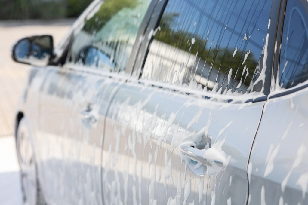 Washing the car with foam at an open car wash